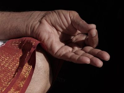 Close up of hands in a mudra position